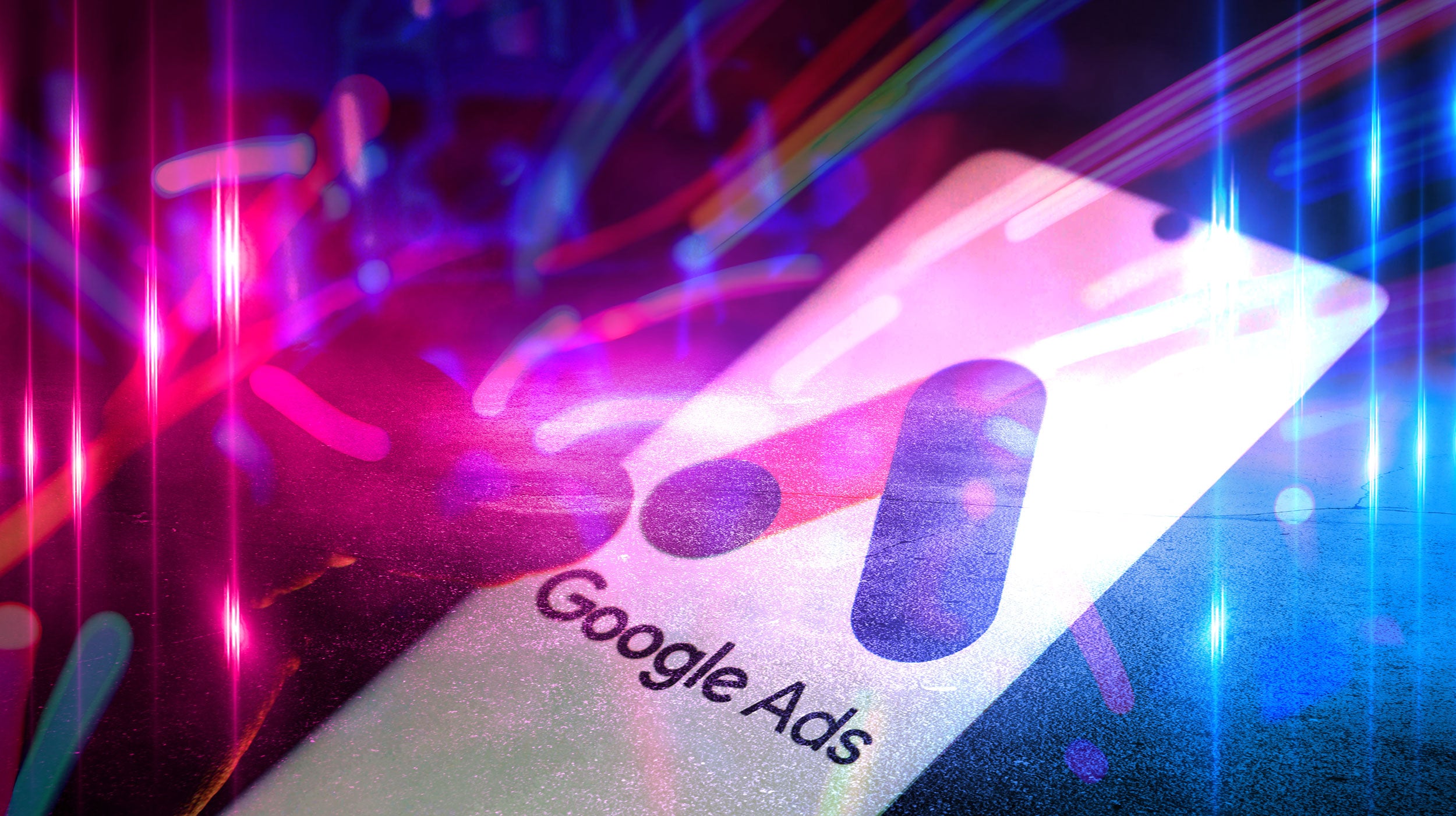 Google Ads logo on a colorful, abstract background with light effects